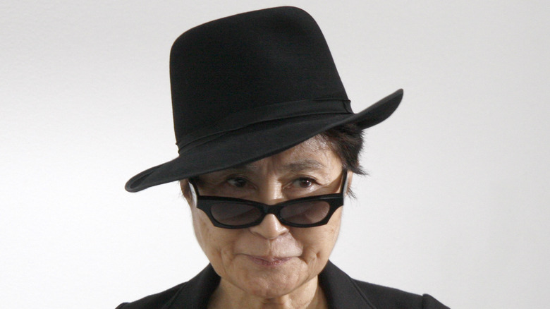 Yoko Ono in hat and sunglasses