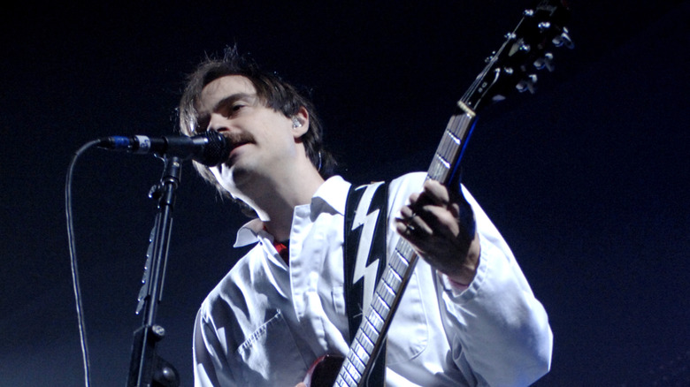 Rivers Cuomo of Weezer playing guitar 2008