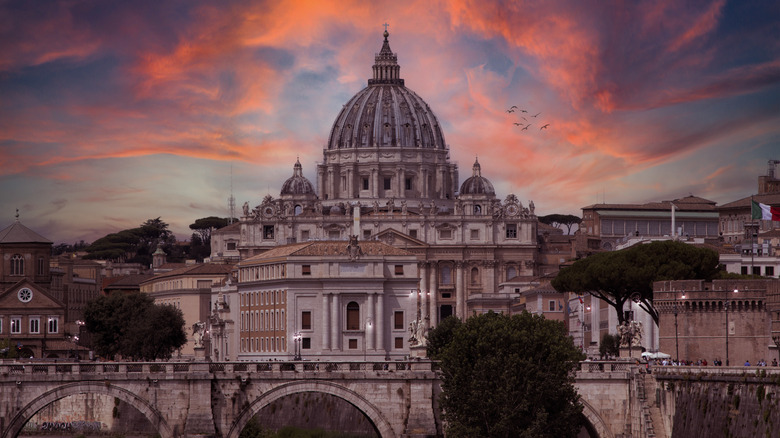 Vatican city under pink clouds