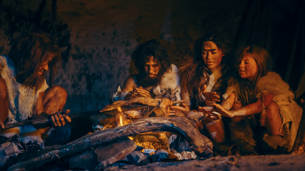 A recreation of an ancient family gathered together to eat meat