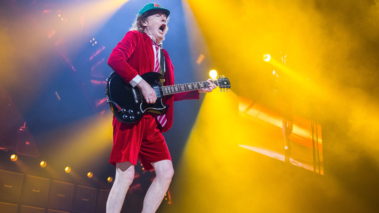 Angus Young performing with AC/DC, 2016