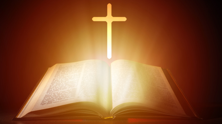 illuminated Bible and cross