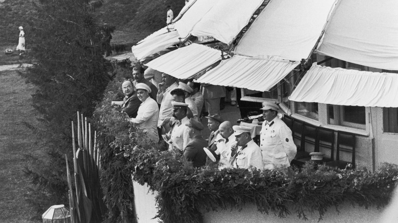 Josef Stalin and other officials watch an air show at Tushino Airfield