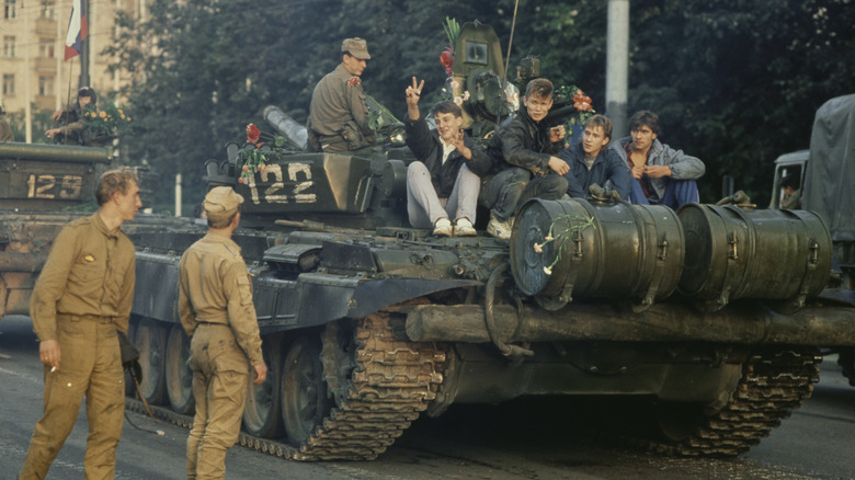 young men sit on tank during August 1991 coup attempt