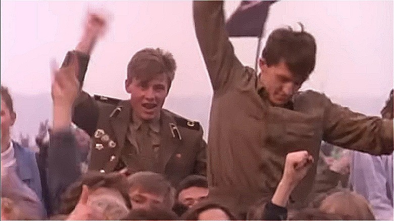 Soldiers on the shoulders of others rocking out to Metallica