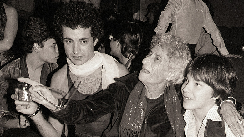 Disco Sally Lippman with arm around teen boy