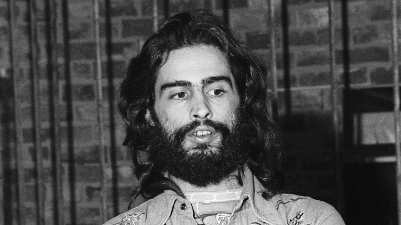 David Mancuso stands with arms crossed, 1974