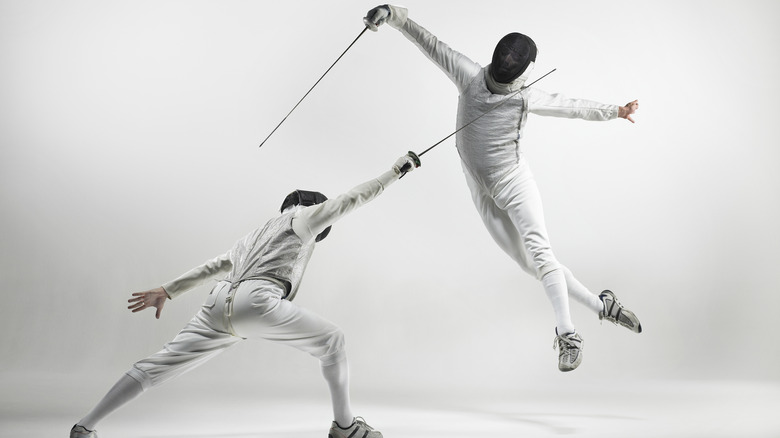 two people fencing