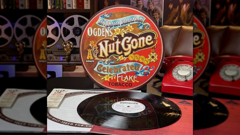 The Small Faces' "Ogdens' Nut Gone Flake" album tin next to the record, resting on a table
