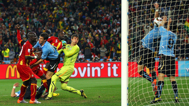 Luis Suarez "saves" Dominic Adiyiah's shot