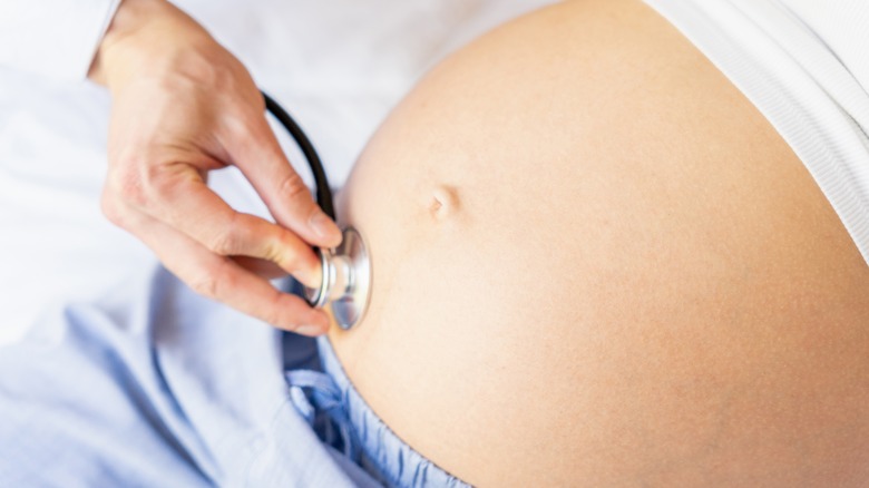 Stethoscope on pregnant belly