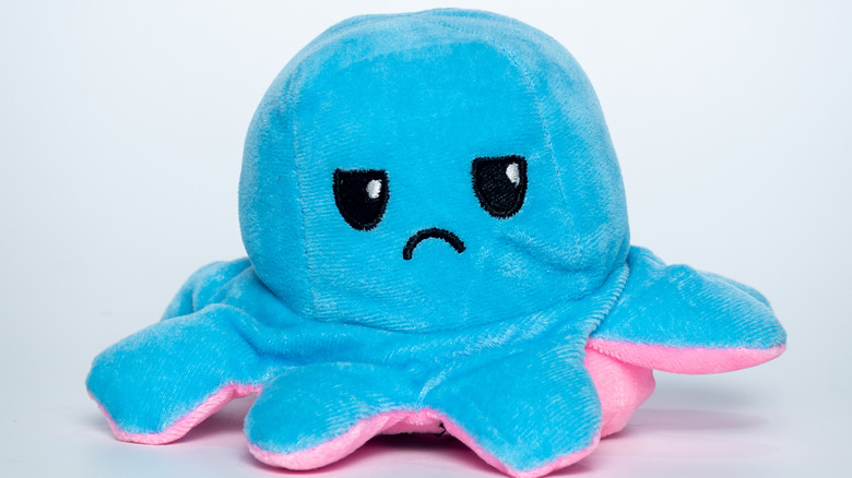 Soft octopus toy that's frowning 
