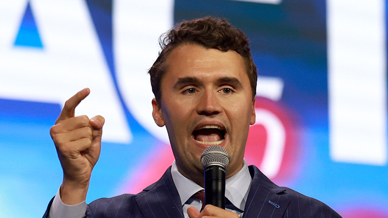 Charlie Kirk speaking into microphone