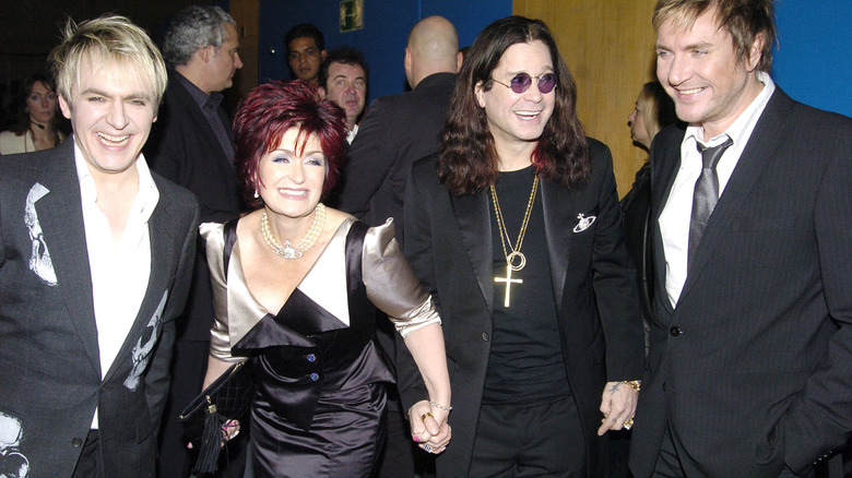 Members of Duran Duran smiling with Ozzy and Sharon Osbourne