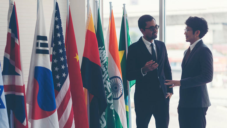 diplomats with flags