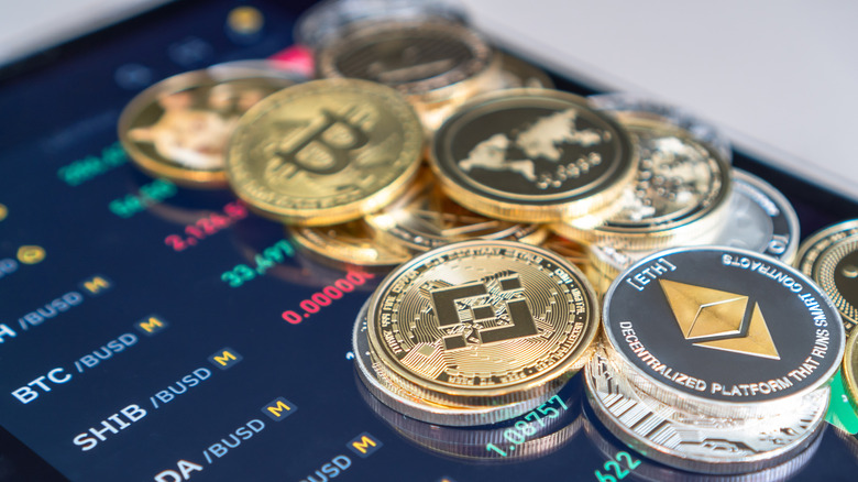 Cryptocurrency coins and a phone