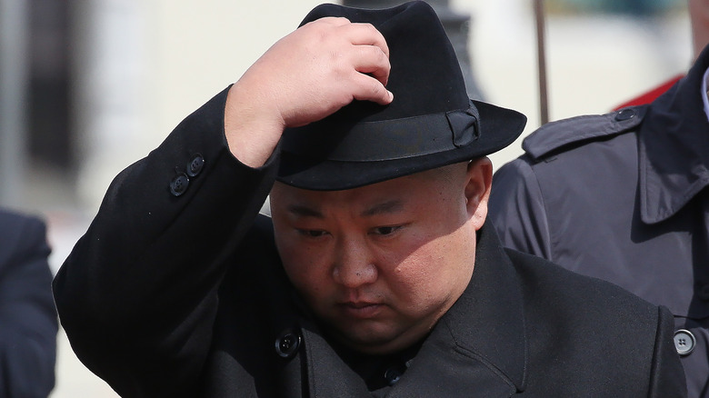 Kim Jong-un in a black hat