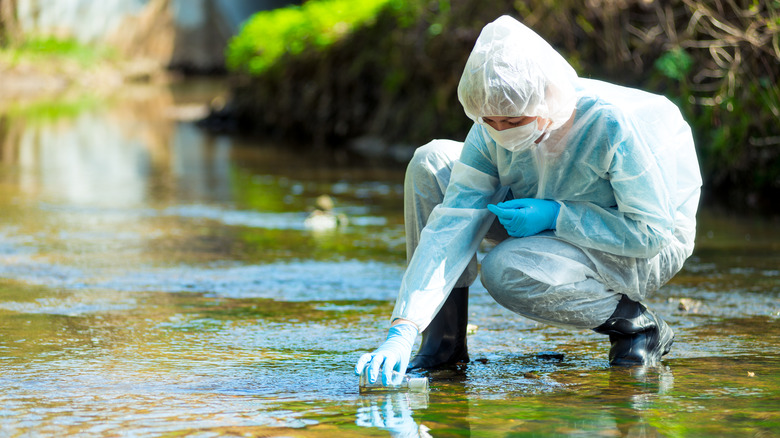 Polluted water person in suit
