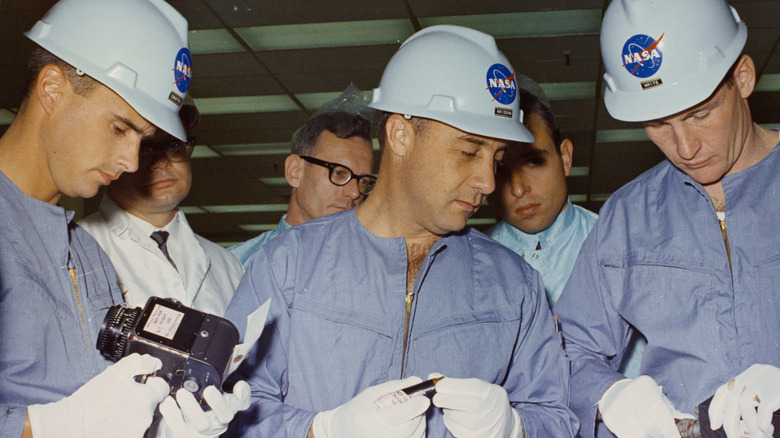 apollo 1 crew inspecting hardware