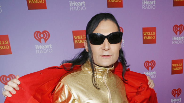 Corey Feldman showing off his outfit on the red carpet in 2016