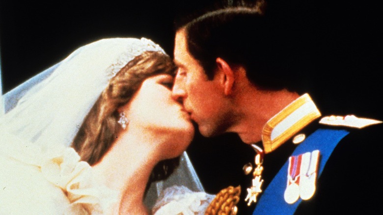 Prince Charles, Prince of Wales and Diana, Princess of Wales, kiss on the balcony after their wedding on July 29, 1981 in London, England