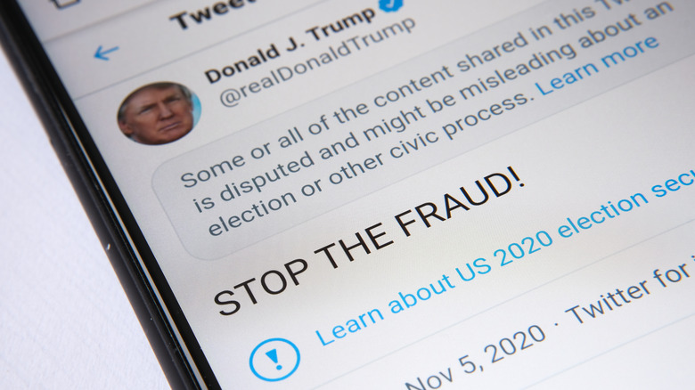 Cellphone with tweet from Donald Trump