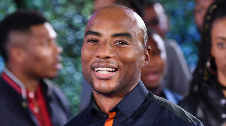 Charlamagne Tha God posing and smiling