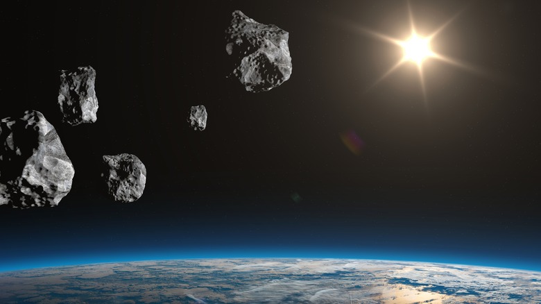 Asteroid Earth and sun
