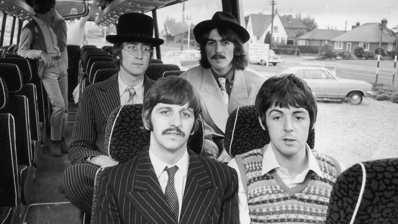 the beatles on a bus in 1967 looking very beatley