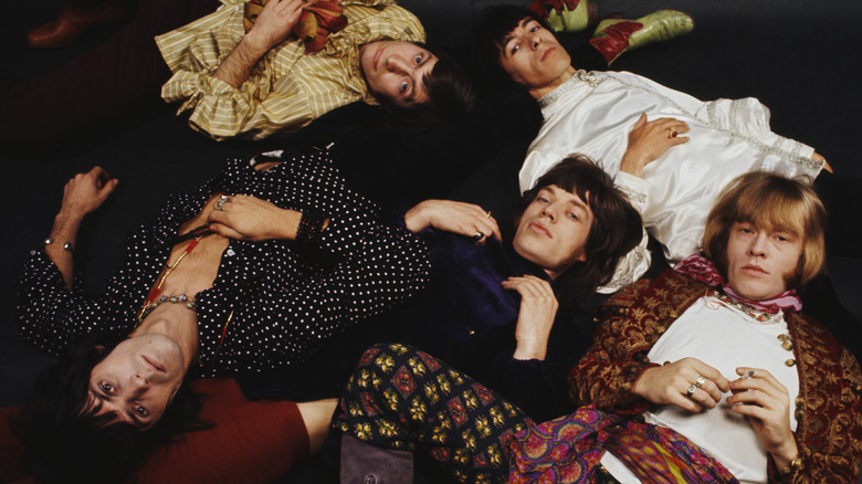 The Rolling Stones posing for photo lying down