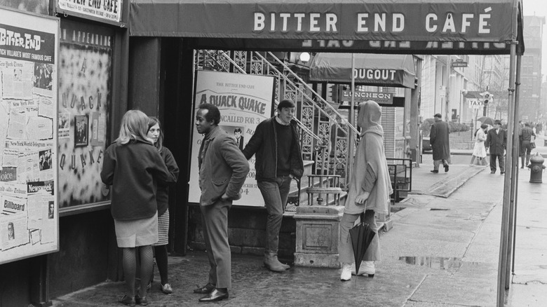 people standing under Bitter End Cafe awning in 1967
