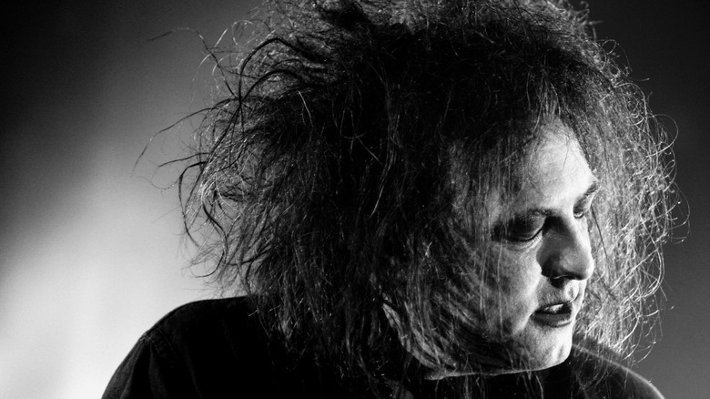 Robert Smith of The Cure performing