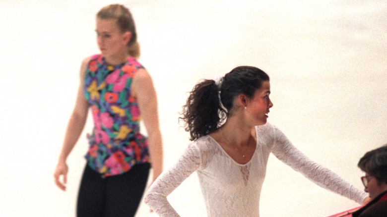 Tonya Harding passing behind Nancy Kerrigan during skating practice in 1994
