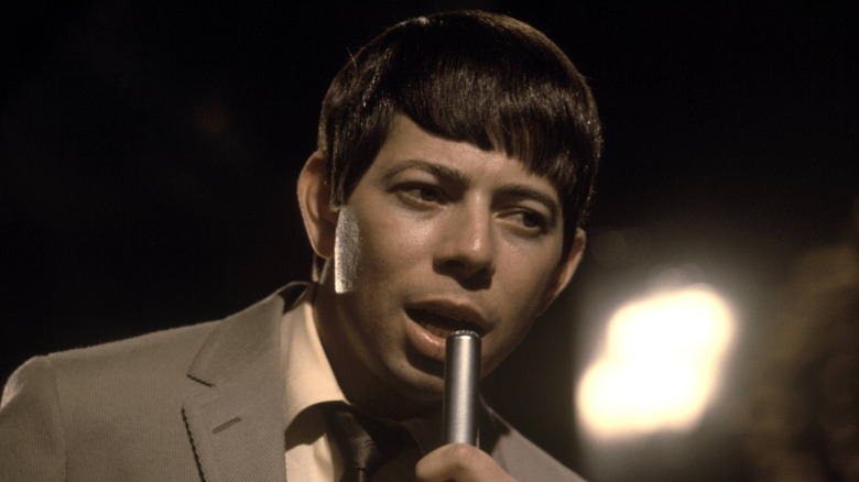 Bobby Goldsboro singing into microphone on TV set in 1960s