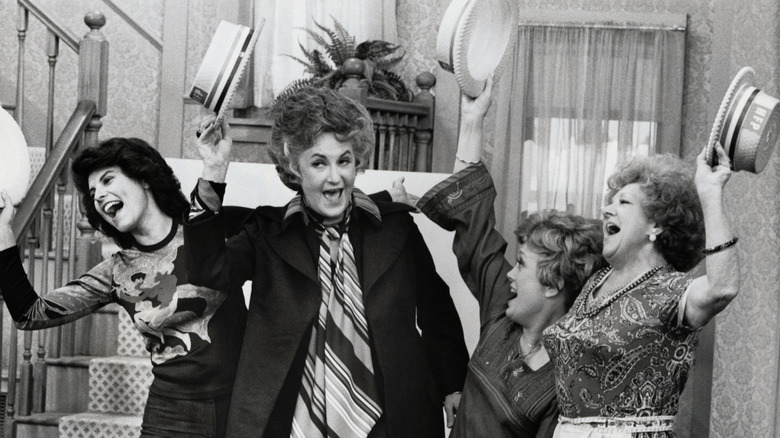 Bea Arthur performing a song and dance with three other women in the TV show "Maude"