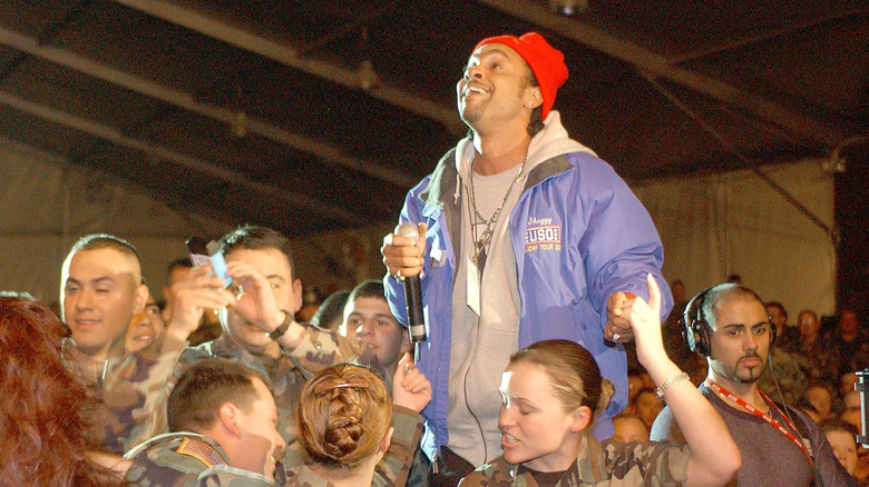 Shaggy in a tent performing a USO show for U.S. troops