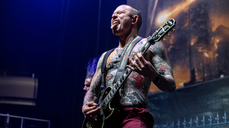 Matt Heafy playing guitar on stage
