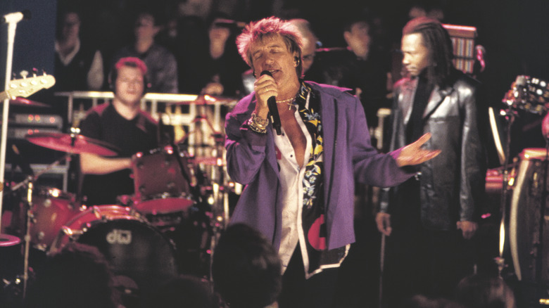 Rod Stewart singing amidst crowd