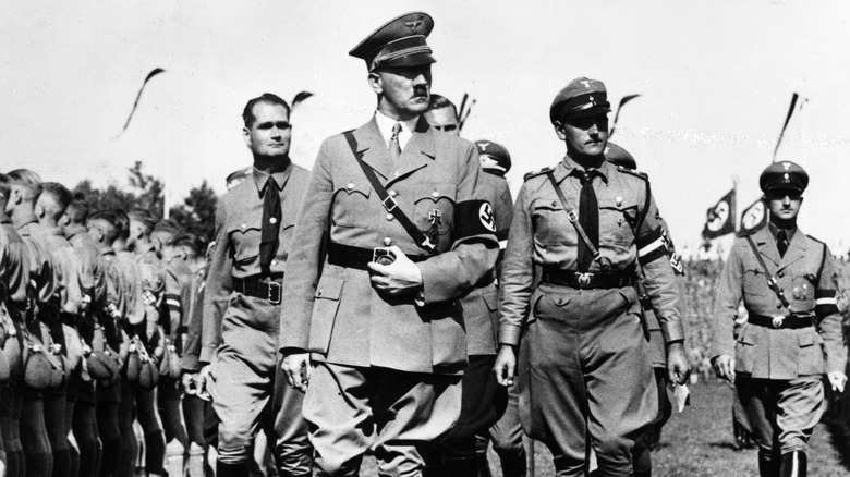 Adolf Hitler and Generals inspecting Hitler Youth members