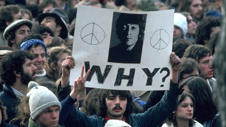 John Lennon fans holding sign