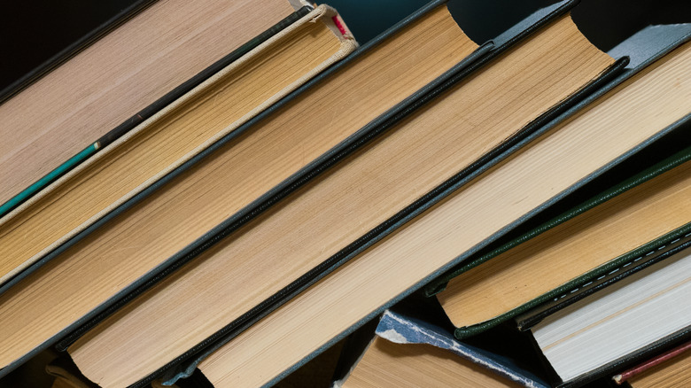 books textbooks stacked on a shelf, a bookshelf with book spines, teaching literature at school College and Institute