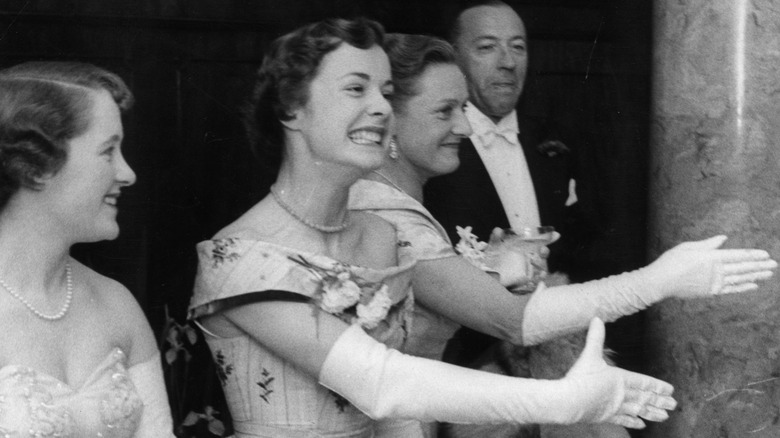 A group of debutantes greeting guests at a ball in 1957