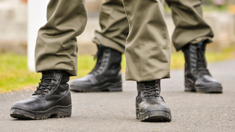 Men and women from Republican Sinn Fein, wear paramilitary uniforms