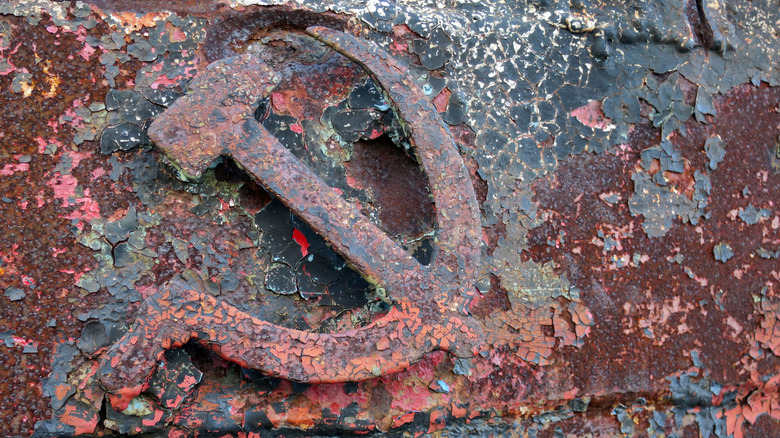 Rusted symbols of the Soviet Union. Hammer and sickle.