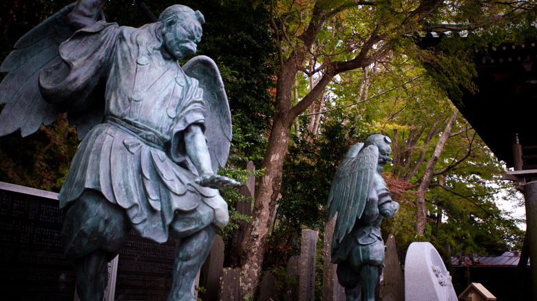 Tengu statues in Japanese forest