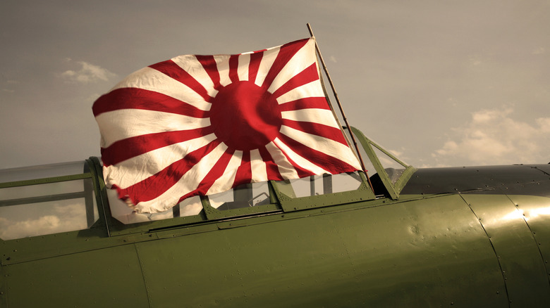 japanese war flag flying from period plane