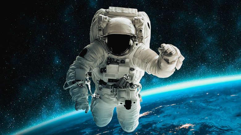 astronaut floating in outer space