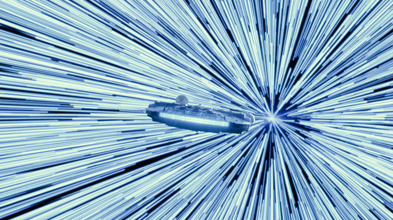 Screenshot of Millennium Falcon moving through streaky representation of hyperspace