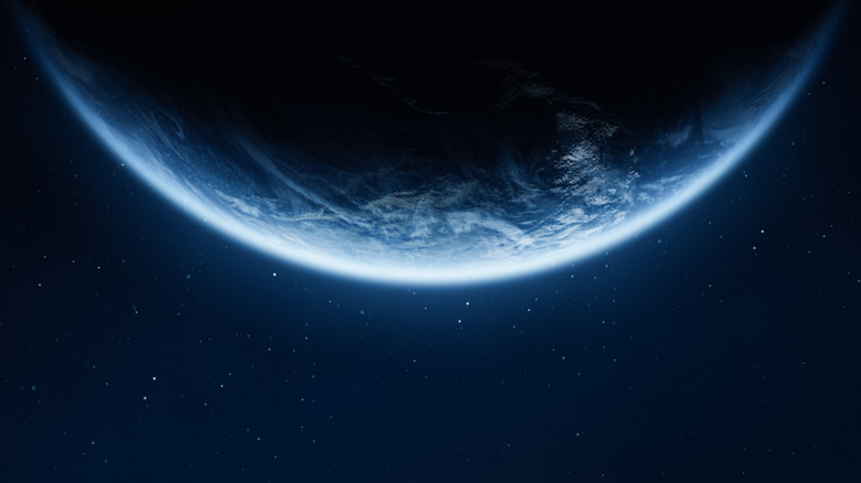3D render of Earth half against starry space background