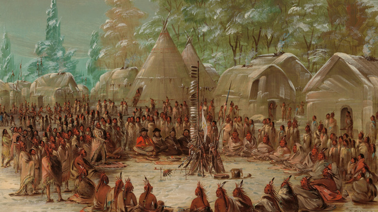 Natives and their guests gather in a circle